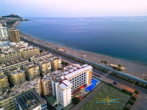 an aerial view of a city and the ocean at Galaxy Beach Hotel Alanya in Mahmutlar