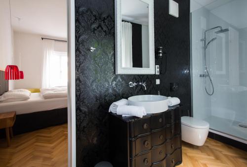 Koupelna v ubytování KIRCHENWIRT an der Weinstrasse - Boutique Hotel