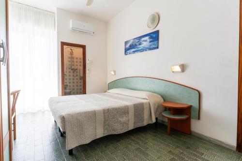 Postel nebo postele na pokoji v ubytování Hotel Mara