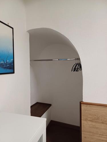 a room with a hallway with a spider on the wall at Il Caminetto in Montecastrilli