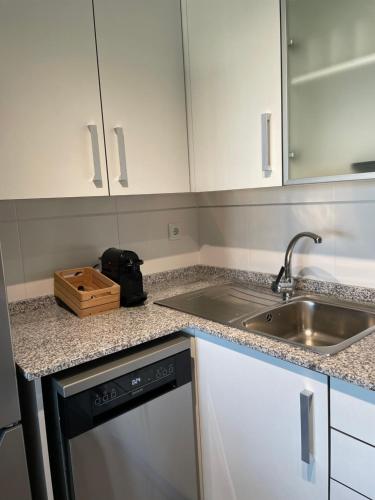 a kitchen with a sink and a counter top at kalma in Moncófar