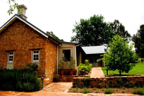a brick house with a garden in front of it at Fordoun Hotel and Spa in Nottingham Road