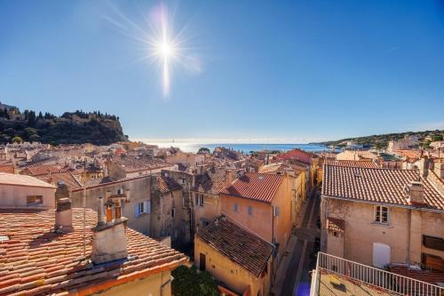 a view of a city with buildings and the ocean at Village house pkg, air conditioning elevator in Cassis