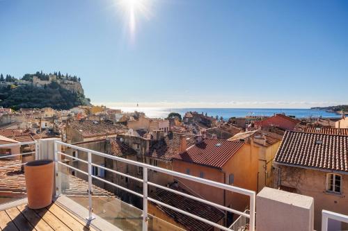 a view of a city from a balcony at Village house pkg, air conditioning elevator in Cassis