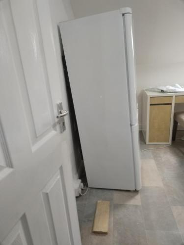 an open door to a room with a wooden door mat at Balfour Street in Bradford
