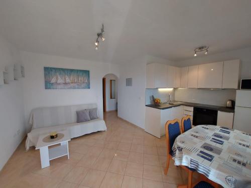 a living room with a couch and a table at Apartments Gojevic in Bol