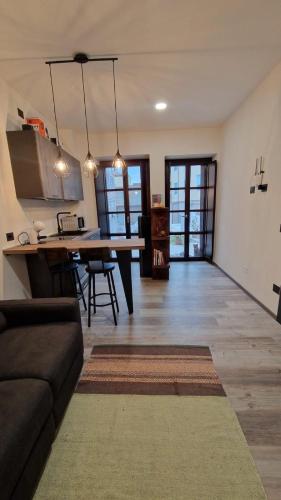 a living room with a couch and a dining table at La Piccola Corte da Anita in Tortolì