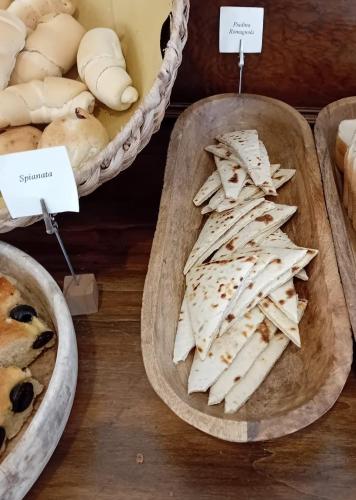a display of cheese and bread at a bakery at Hotel Bikini in Rimini