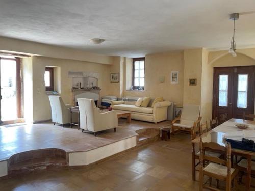 a living room with a couch and a table at Olive House in Polichnítos