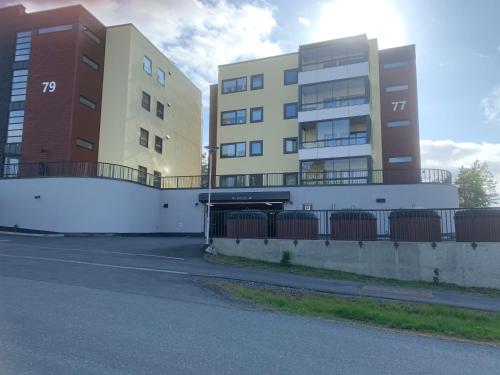 two tall buildings are next to a street at Bedroom&ensuite in Moss