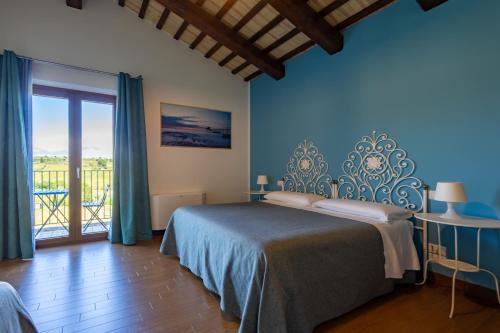 Ένα ή περισσότερα κρεβάτια σε δωμάτιο στο Relais Piano Valle