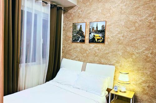 Katil atau katil-katil dalam bilik di iWandr Suites at SMDC Charm Residences