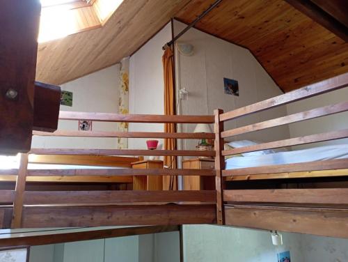 a row of wooden benches in a church at Studio numéro 2 , 3 couchages in Chabottes