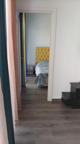 a bedroom with a bed in the middle of a hallway at Chacha house in Yasmine