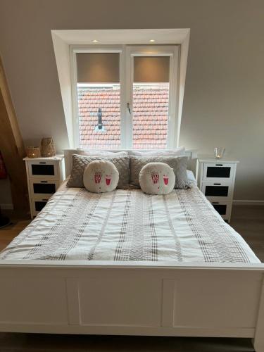 a large white bed in a room with a window at Luxury Spa with Sauna, Bath and Cinema Private in Bodegraven