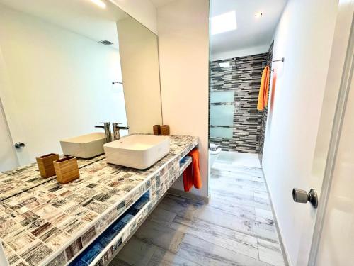 a bathroom with a sink and a shower at Michas House in Puerto del Carmen