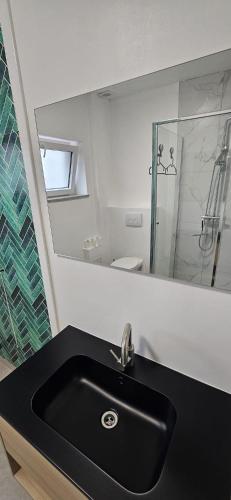 Bilik mandi di Chambres jumelles tout confort