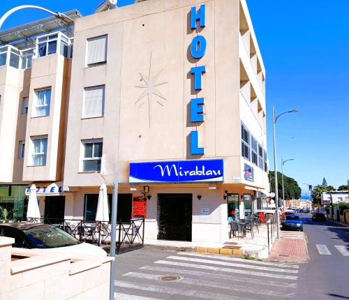 a building with a sign for a hotel at Hotel Mirablau in Aguadulce