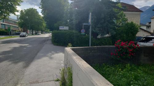 a street with cars parked on the side of the road at Hall in Tirol erster Stock Nord in Hall in Tirol