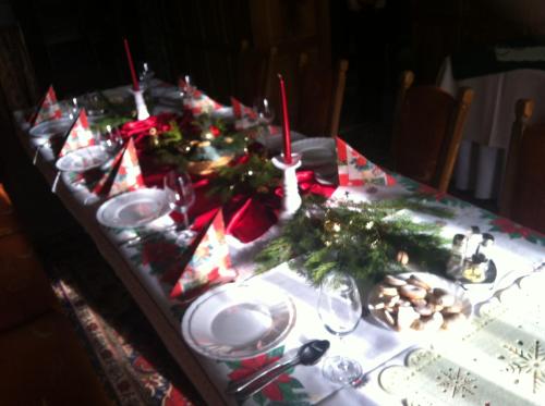 a table with christmas decorations on top of it at Penzion Havran in Ždiar