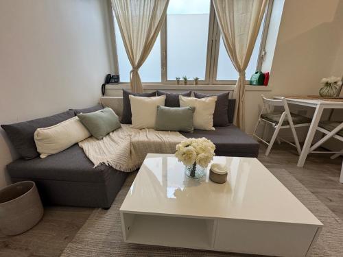 a living room with a couch and a table at 29 Sweet 1 Bed sleeps 4 with free parking BHX NEC in Sheldon