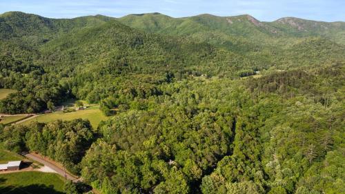 an aerial view of a forest with mountains in the background at Mins To Highlands Hot Tub, Fire Pit, Game Room in Franklin