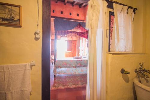 Postel nebo postele na pokoji v ubytování Casa Museo RAKKANA - En el Centro de Requena