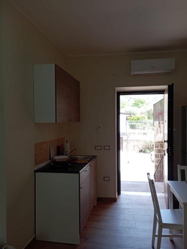 a kitchen with a sink and a counter top at Il Ponticello in Gradillo