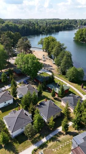 an aerial view of a village next to a lake at Domek nad jeziorem Łagów - Mundi, Lake Park in Łagów