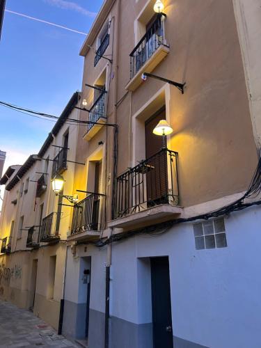 a building with balconies and lights on a street at kasapereira23 in Logroño