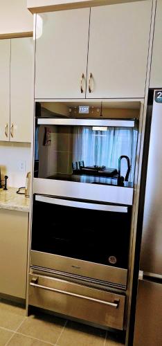 a kitchen with a large oven in a kitchen at Luxury 5 Bed Retreat for 12 with Gourmet Kitchen in Paris