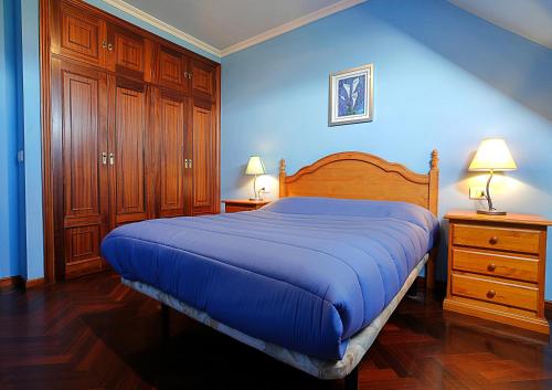 Katil atau katil-katil dalam bilik di Apartamento con parking en Vilanova de Arousa