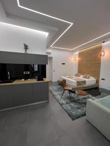 a living room with a bed and a kitchen at Luxury Marina apartments in Rijeka