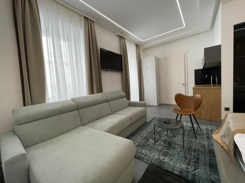 a living room with a couch and a table at Luxury Marina apartments in Rijeka