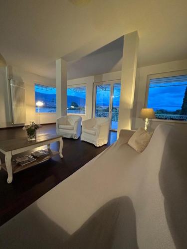 a bedroom with a bed and a living room at La Terrazza degli Angeli Guest House in Santa Maria degli Angeli