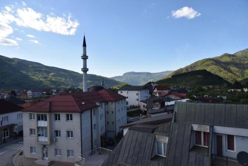a view of a town with mountains in the background at Cattleya hotel in Plav