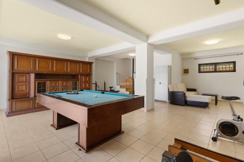 a living room with a pool table in it at Villa Rea Chania in Argoulidhés