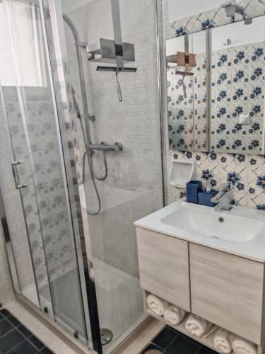a bathroom with a shower and a sink at La Casa delle Zie in Maglie