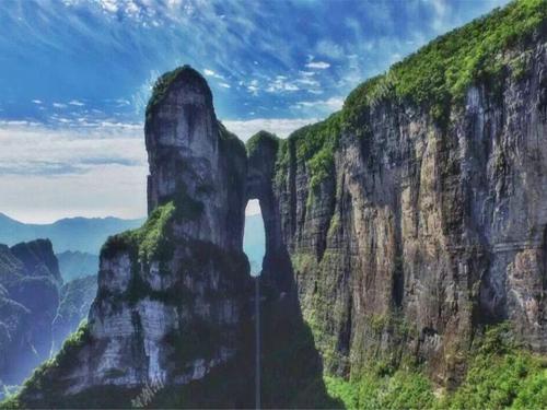 a view of a mountain with a tall cliff at Zhangjiajie Tianmenshan Xuyuan Hotel in Zhangjiajie