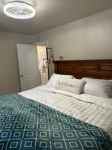 a bedroom with a large bed with a pillow on it at Comfort and Cozy in Fairbanks !! in Fairbanks