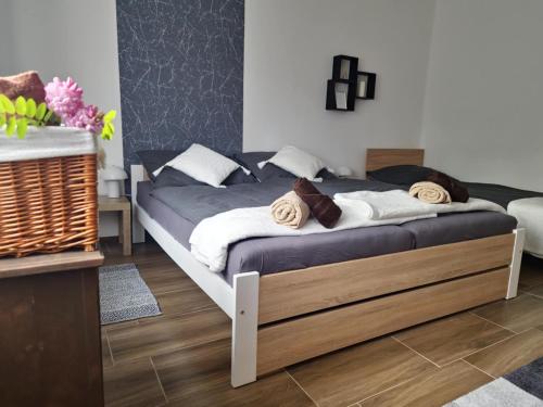 Postel nebo postele na pokoji v ubytování Vida Apartman