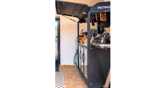 a view of a kitchen with a black counter top at Casa Nova Maison d'hôtes in Sagone