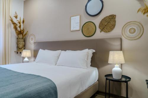 Ένα ή περισσότερα κρεβάτια σε δωμάτιο στο Viridiano Rooms