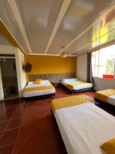 Una cama o camas en una habitación de Finca los Bohíos