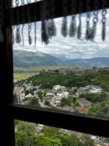 a view of a city from a window at Guest House Salaria in Gjirokastër