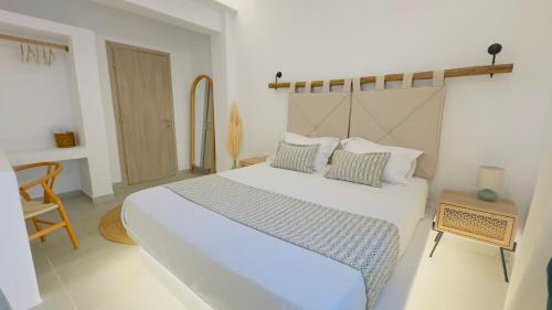 Ένα ή περισσότερα κρεβάτια σε δωμάτιο στο Michelangelo Suites