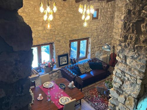 a living room with a couch and a table at Masiadenjust in Rojals