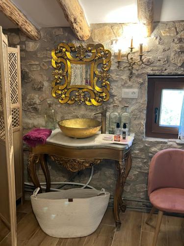 a bathroom with a sink and a mirror on the wall at Masiadenjust in Rojals