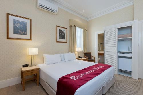 a bedroom with a large bed in a room at Hotel Delta Near Delhi AIRPORT in New Delhi