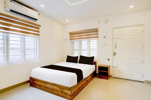 Ένα ή περισσότερα κρεβάτια σε δωμάτιο στο Hotel O Alleppey Inn